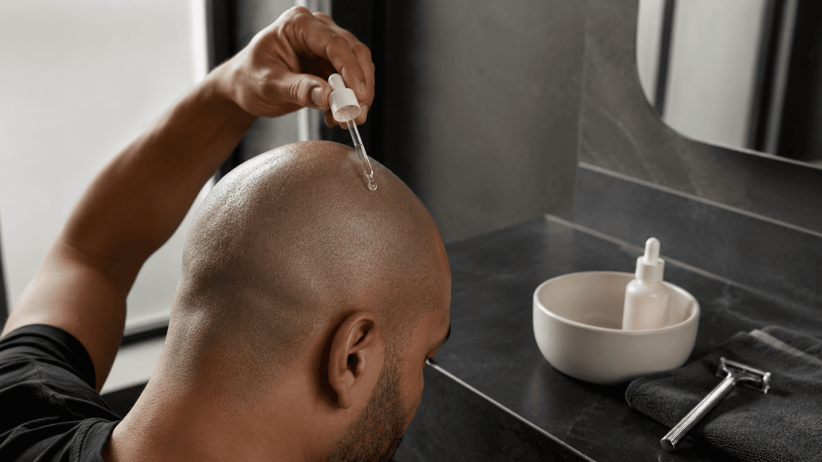 Man following a soothing post-shave scalp care routine for bald head comfort